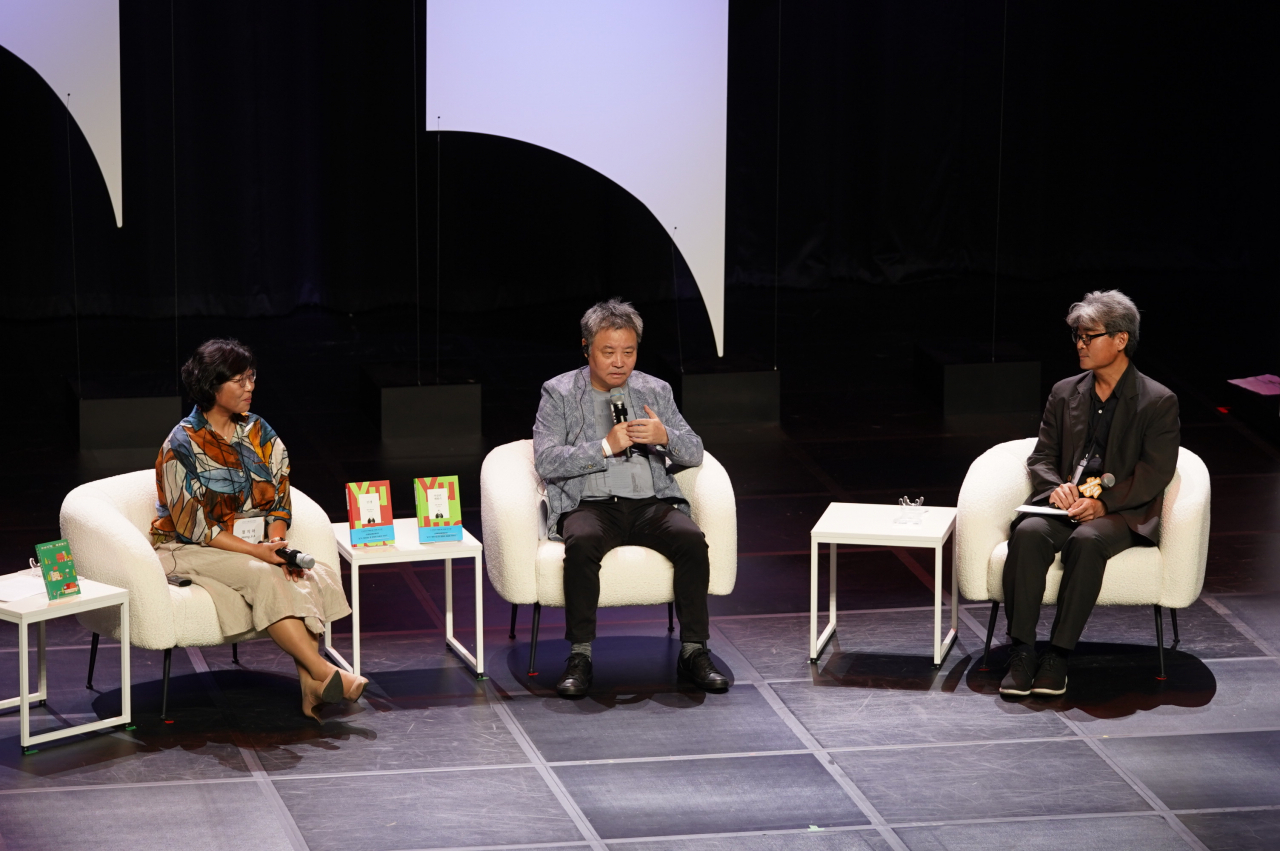 (From left) Writers Jeong Ji-a, Yu Hua and literary critic Son Jeong-soo attend the opening of the Seoul International Writers' Festival, on Nodeulseom in Seoul on Sept. 8. (SIWF, LTI Korea)