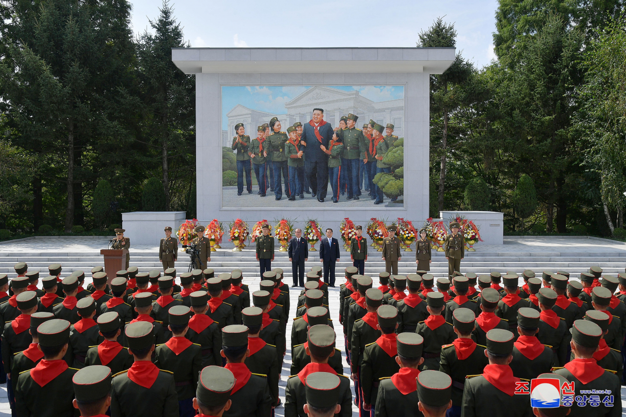 North unveiling a mosaic depicting North Korean leader Kim Jong-un being erected at Mangyongdae Revolutionary School in Pyongyang, on Tuesday. (Yonhap)