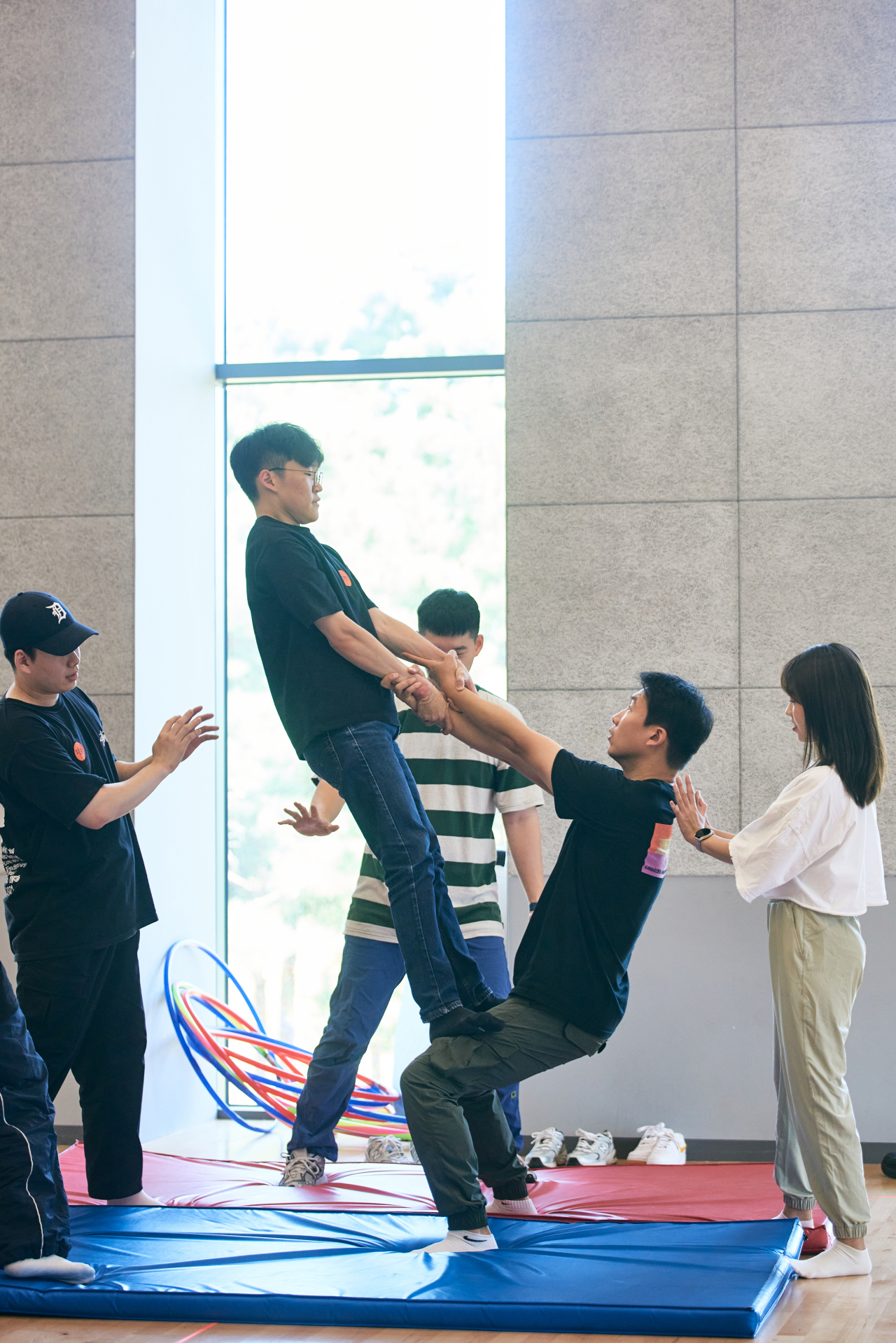 Participants try out hand-to-hand acrobatics during a 