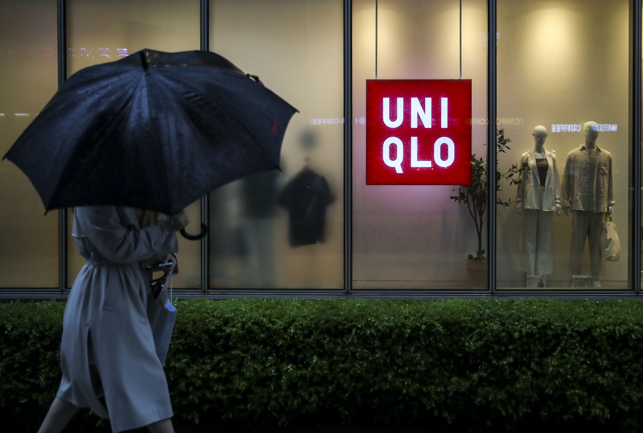 A person walks past a Uniqlo store in Seoul, April 5. (Newsis)