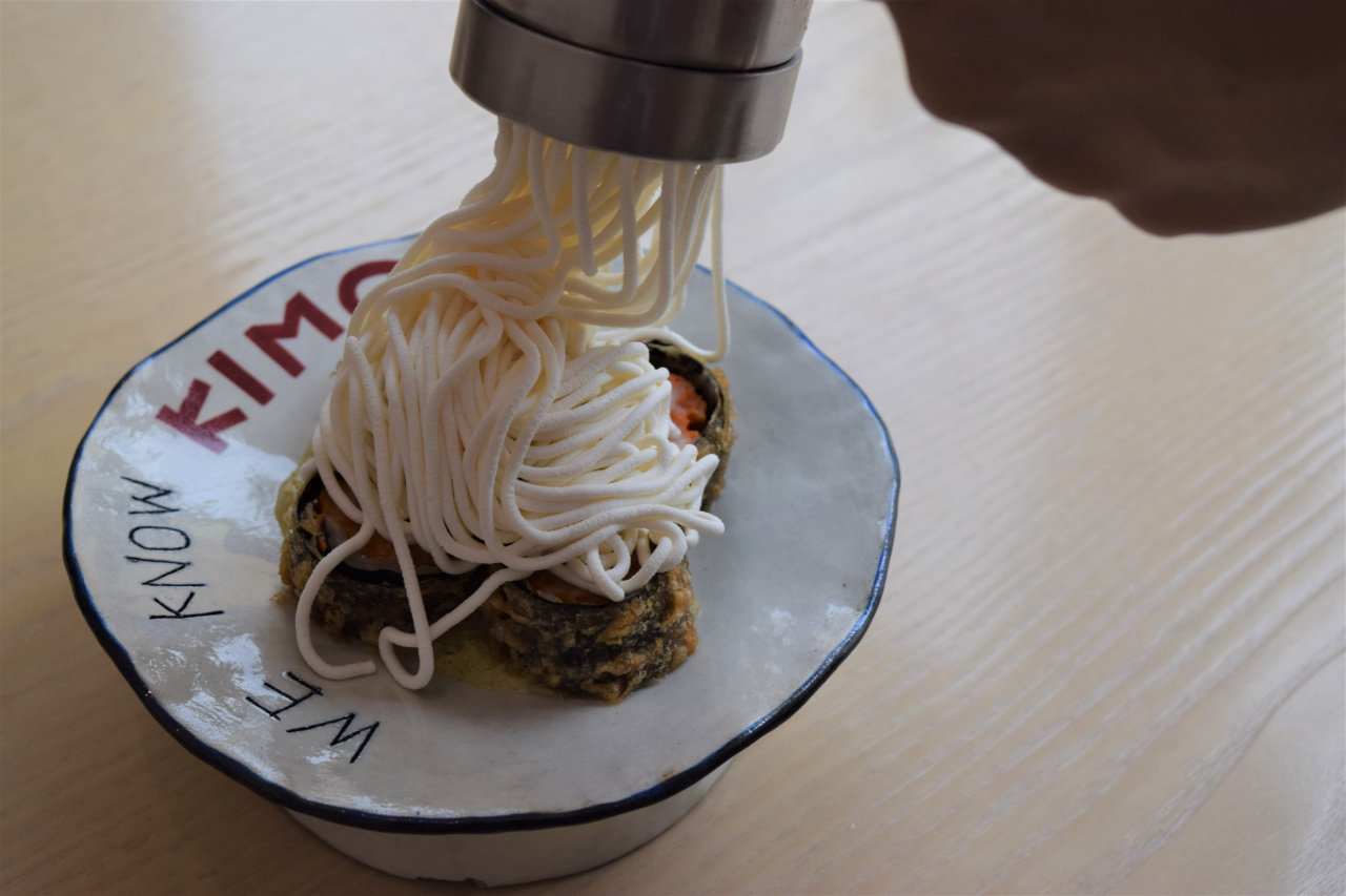 Fried kimchi twigim with dongchimi sour cream (Kim Hae-yeon/ The Korea Herald)
