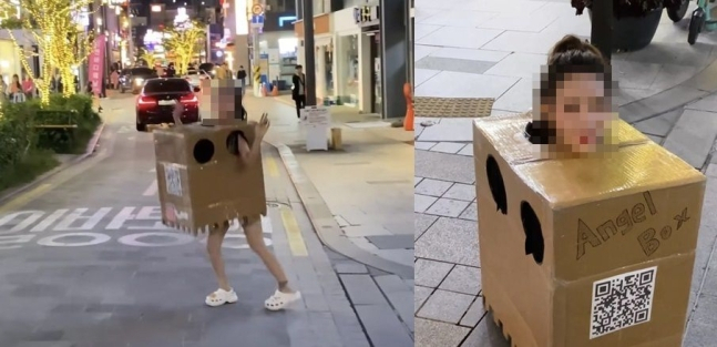 A woman walks around in Apgujeong-dong while wearing a box on Oct. 13. (Online Communities)