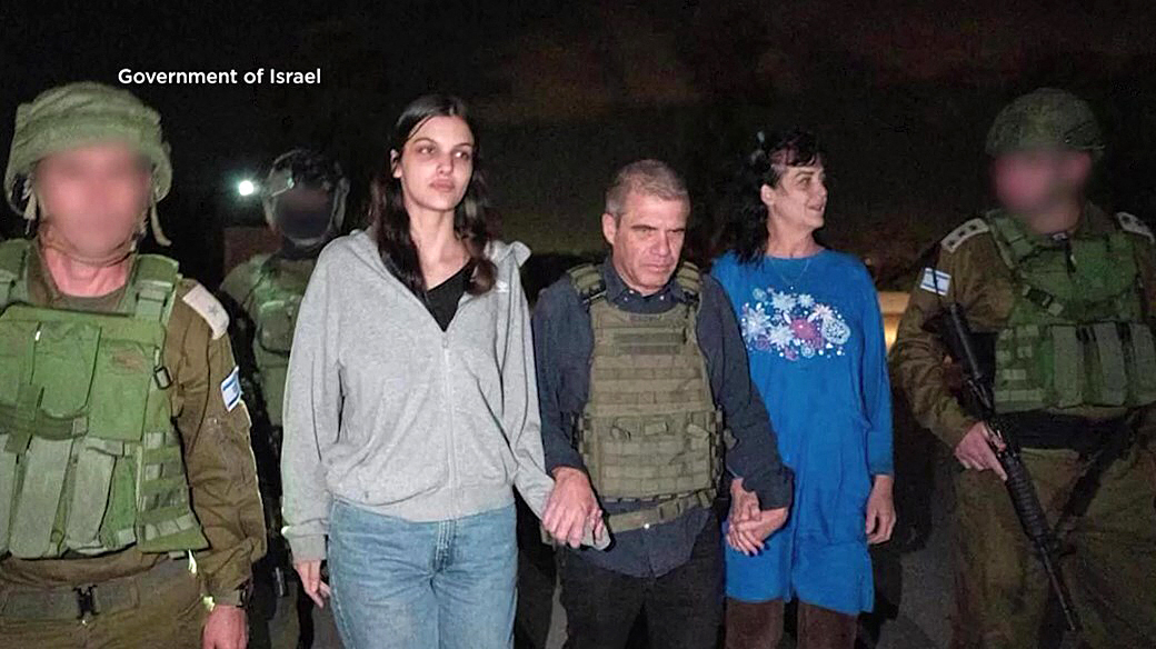 This handout picture courtesy of the government of Israel taken on Friday (local time) shows Natalie Shoshana Raanan (2nd L) and Judith Tai Raanan after being held hostage and later released by Hamas at an undiclosed location. (Photo provided by the Government of Israel-AFP)