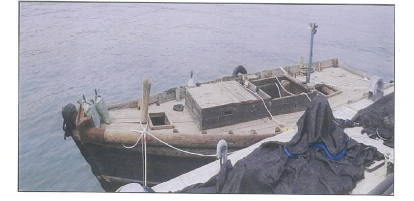 This undated picture shows the wooden boat a North Korean family used to cross the sea to get to South Korea. (photo provided to The Korea Herald)
