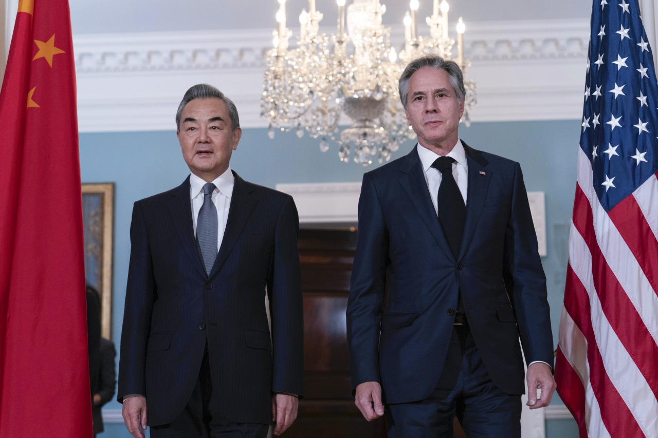 Secretary of State Antony Blinken (right) and Chinese Foreign Minister Wang Yi walk to meet the media at the State Department in Washington on Thursday, in this Associated Press photo. (Yonhap)