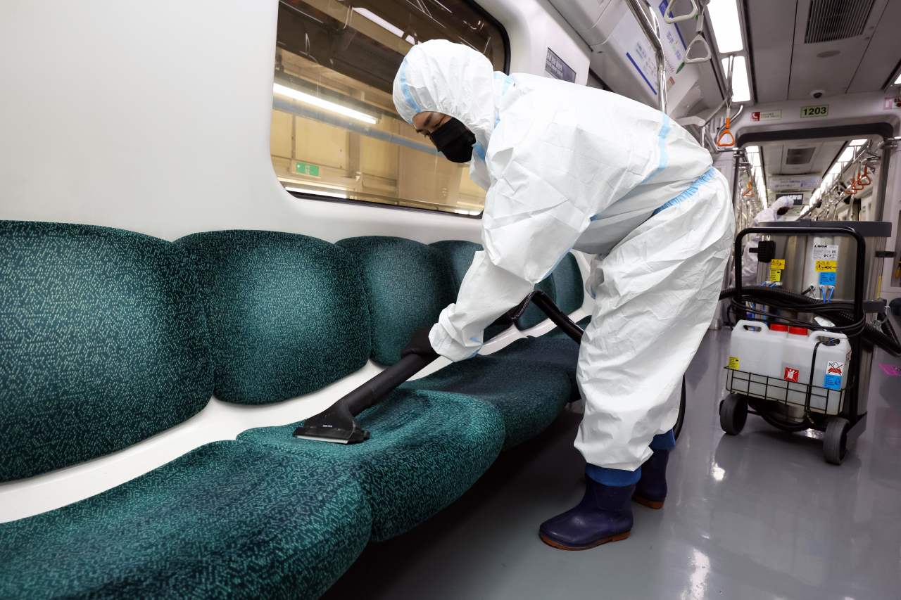 A worker disinfects a subway train with high-temperature steam at a depot in Gwangju on Wednesday, as a preventive measure against the spread of bedbug infestations. (Yonhap)