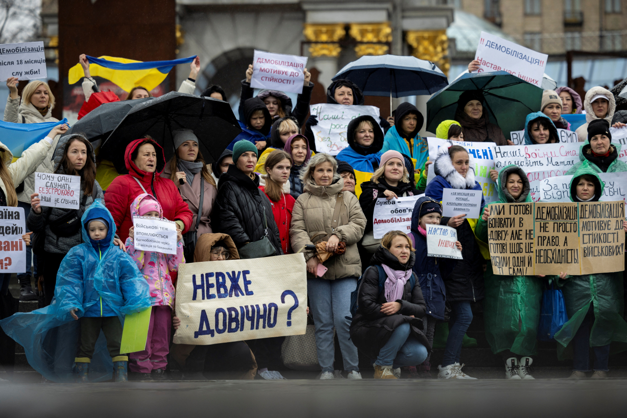 Relatives of Ukrainian servicemen attend a protest calling for legislation regulating the length of active military duty and the frequency of frontline rotation in Kyiv, amid Russia's attack on Ukraine, November 12, 2023. (Reuters)