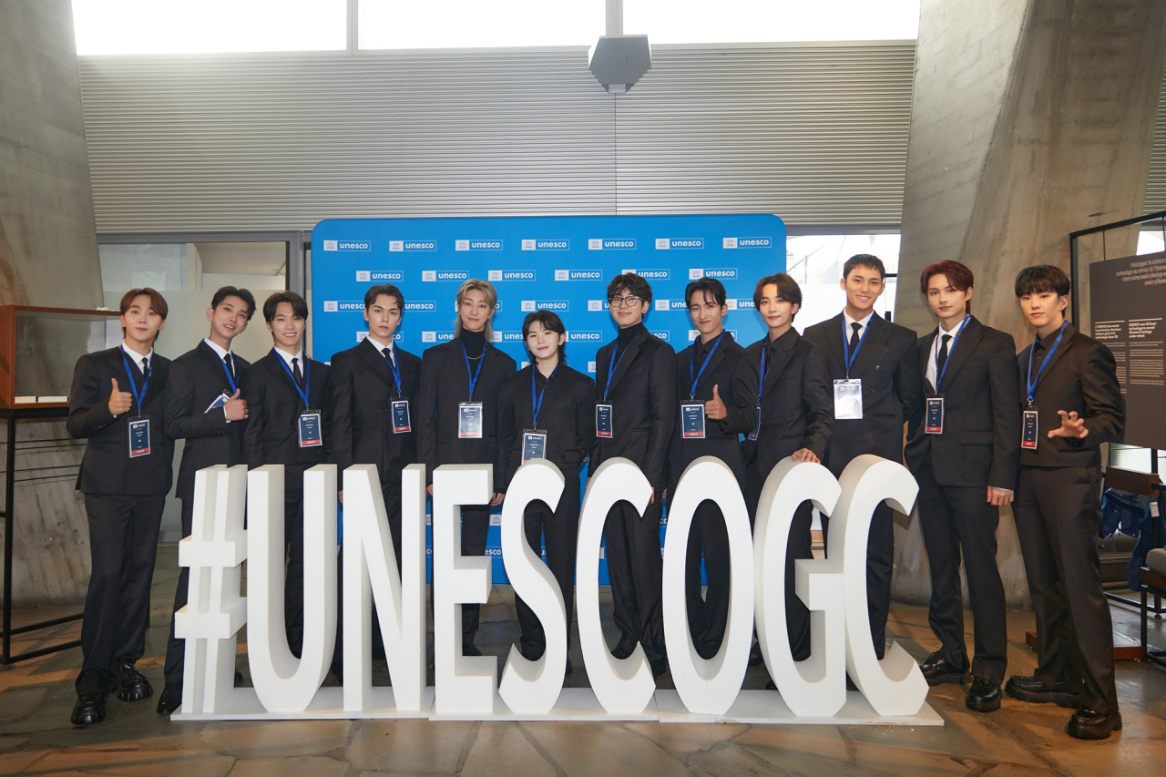 K-pop group Seventeen poses for a picture at UNESCO headquarters in Paris on Tuesday. (Pledis Entertainment)
