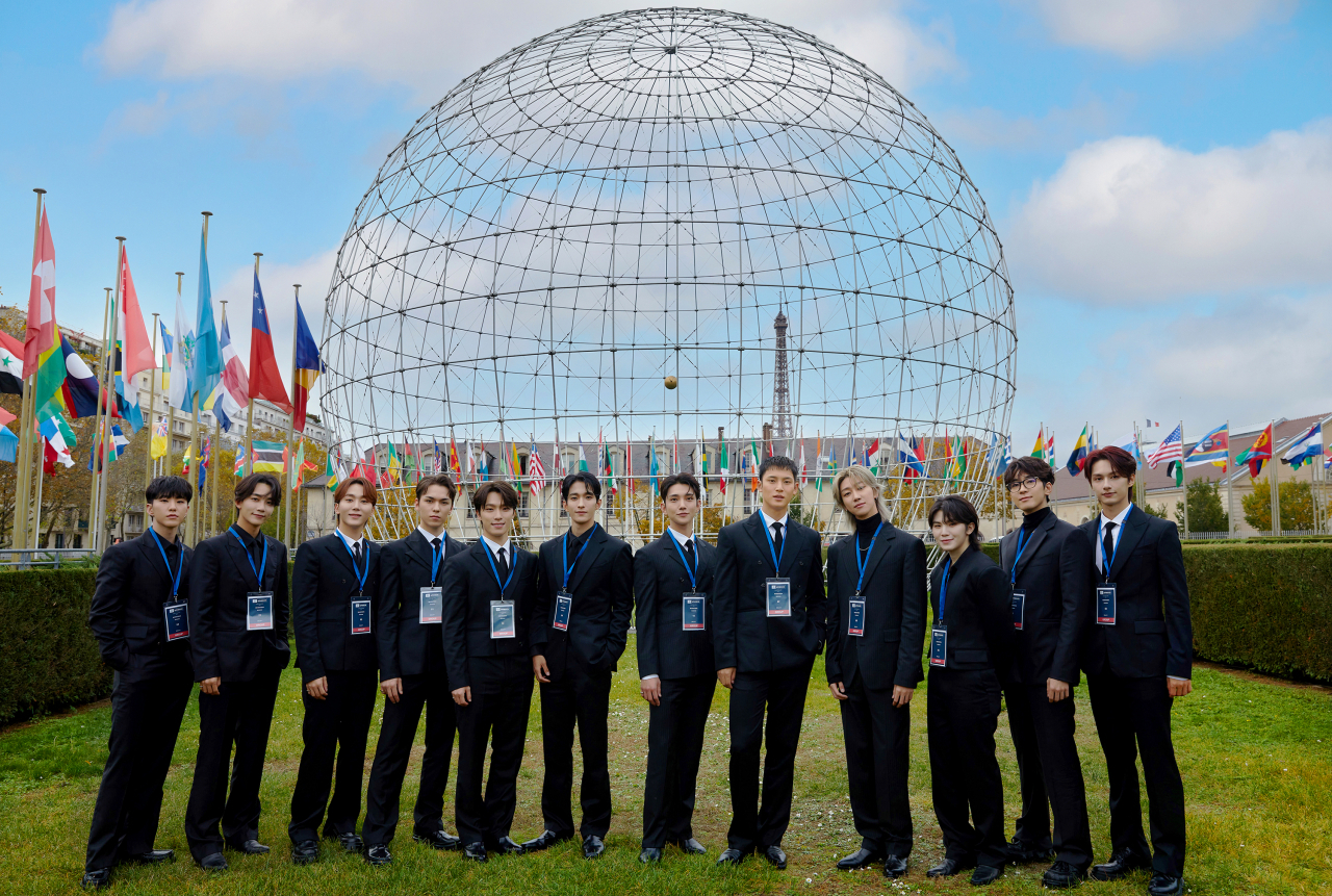 K-pop group Seventeen poses for picture at UNESCO headquarters in Paris, France, on Tuesday. (Pledis Entertainment)