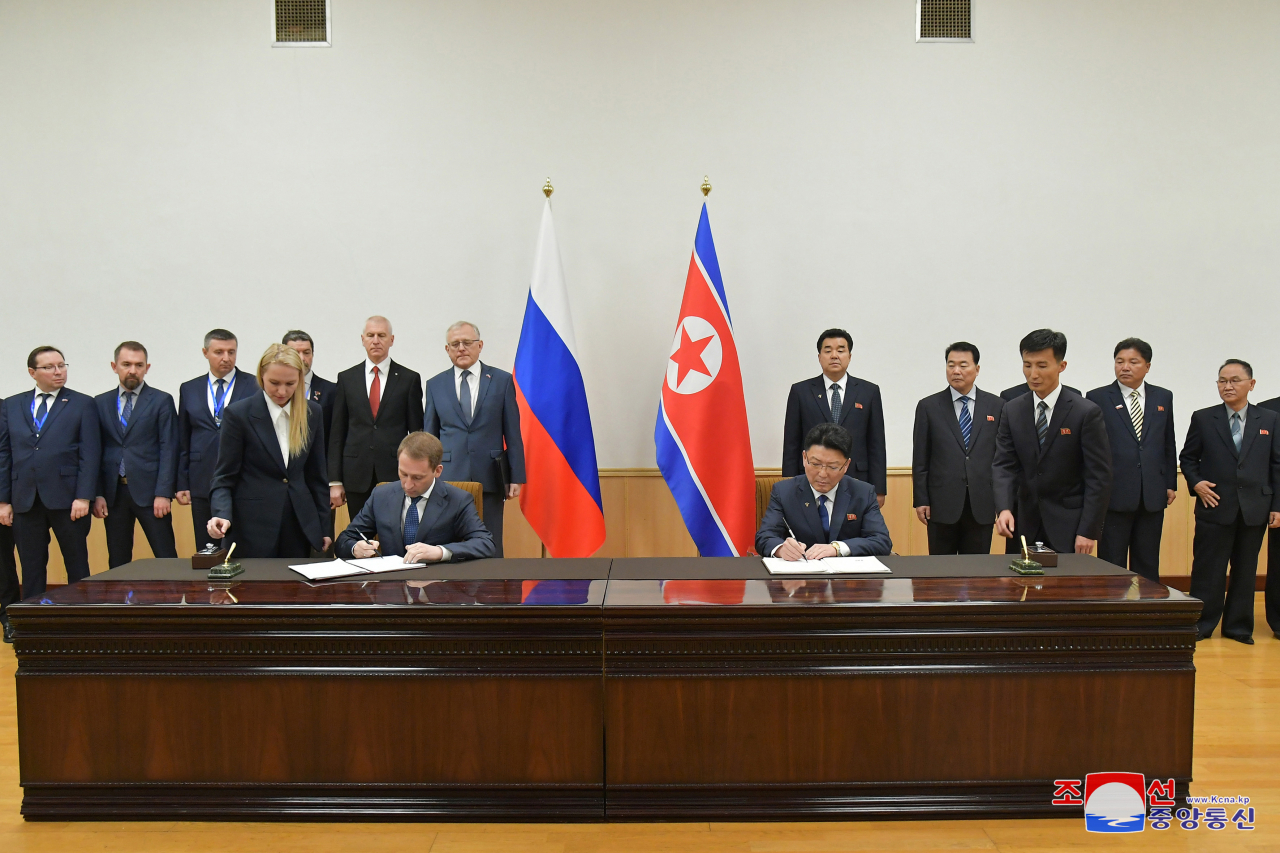 North Korea and Russia sign a protocol on expanding cooperation in the fields of trade, economy, science and technology on Wednesday, following the 10th meeting of the Committee for Cooperation in Trade, Economy, Science and Technology in Pyongyang. (KCNA)