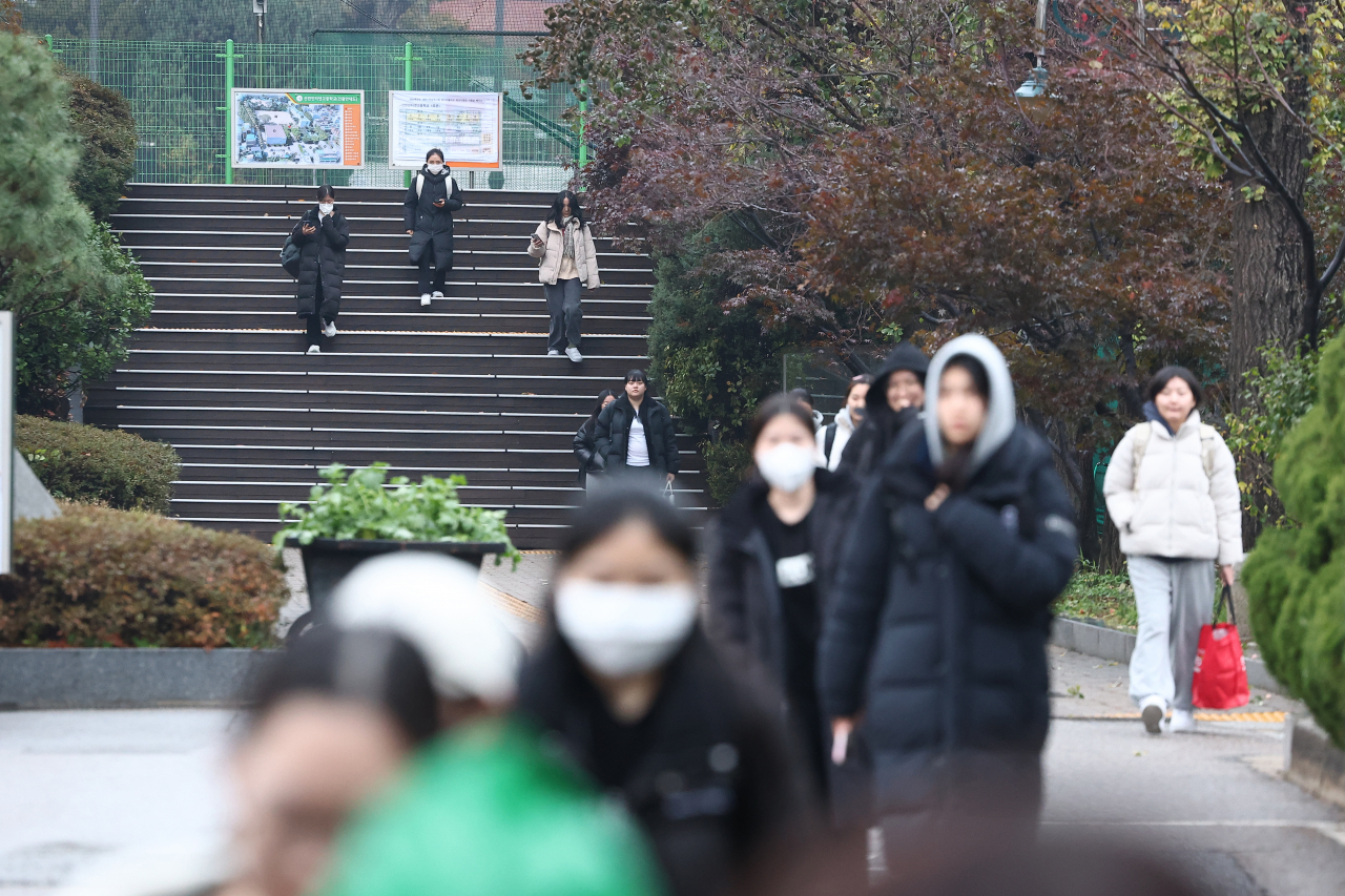 Students exit Sunrin Internet High School in Seoul on Thursday after completing the 2024 Suneung. (Yonhap)