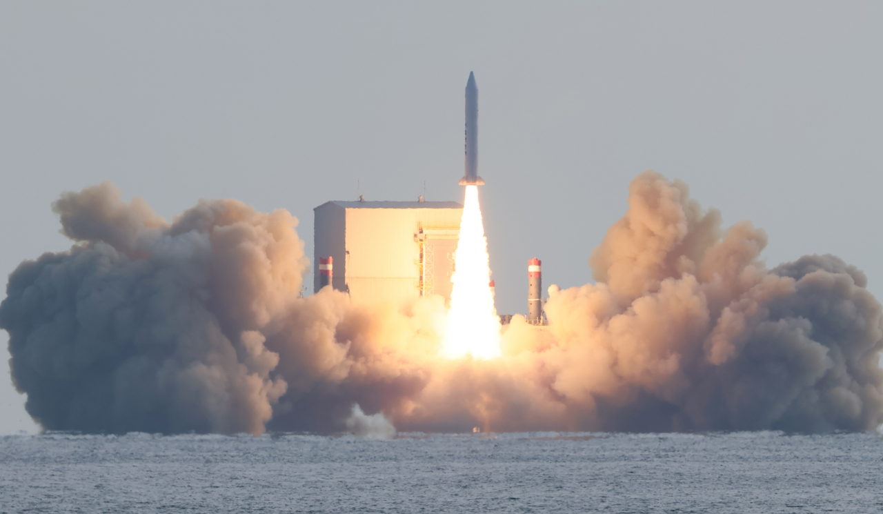 A solid-fuel space launch vehicle developed by the state-run Agency for Defense Development equipped with a small satellite manufactured by Hanwha Systems, a local major defense contractor, takes off from a barge in waters off Jeju Island on Monday afternoon. (Yonhap)