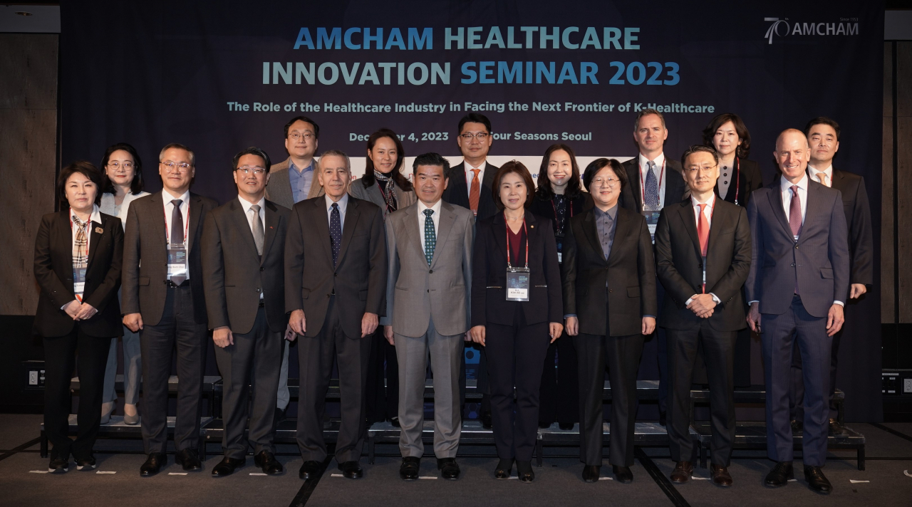 Participants in the 14th edition of the AmCham Healthcare Innovation Seminar pose for a photo at the Four Seasons Hotel Seoul, Monday. (AmCham)