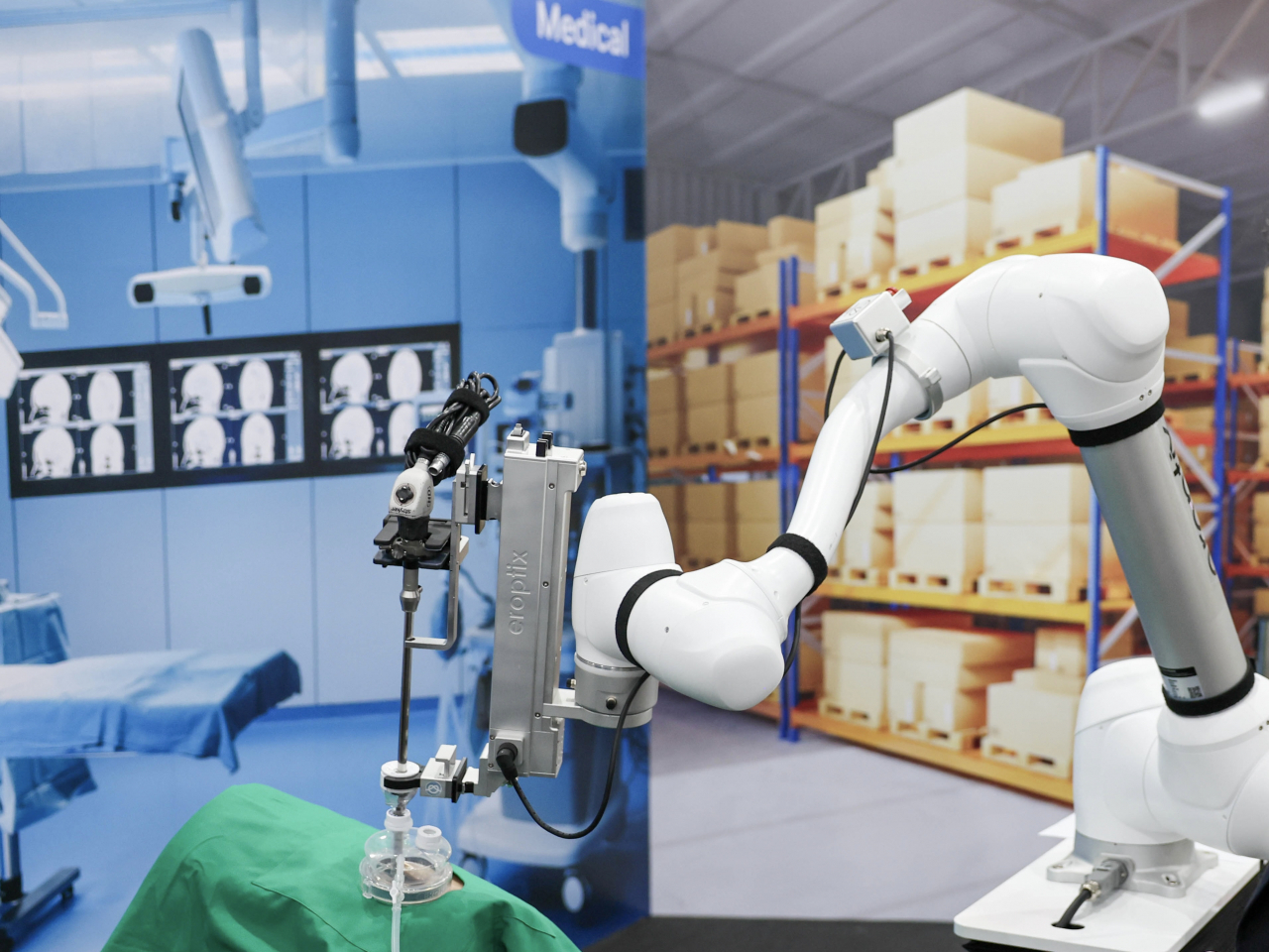 A laparoscopic surgical assistant cobot, a joint product of Doosan Robotics and medical equipment maker Erop, holds a camera-equipped instrument that can operate through small incisions, providing a clear view of the internal organs, reducing physical strain on surgeons. (Doosan Robotics)