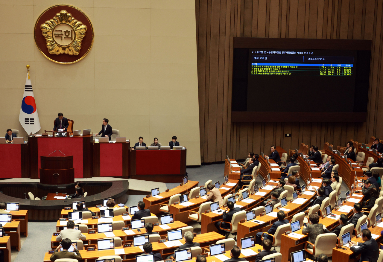 A screen inside the Plenary Chamber of the National Assembly in Seoul shows the revote results of the pro-labor 