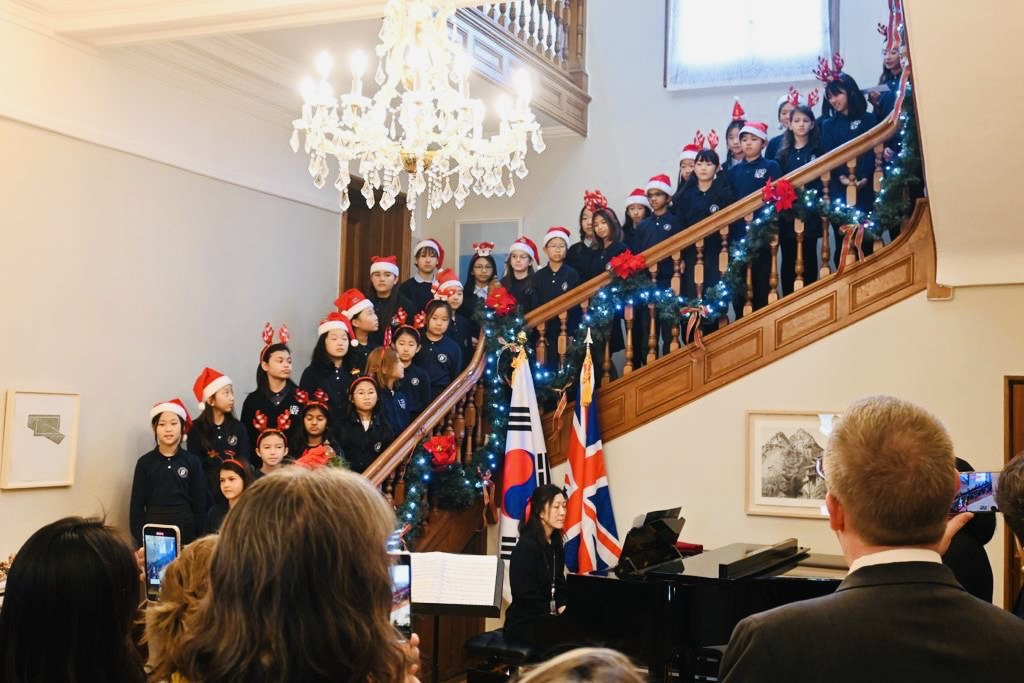 The Seoul Foreign British School children's choir stages a performance at the residence of British Ambassador Colin Crooks in central Seoul on Thursday. (Sanjay Kumar/The Korea Herald)