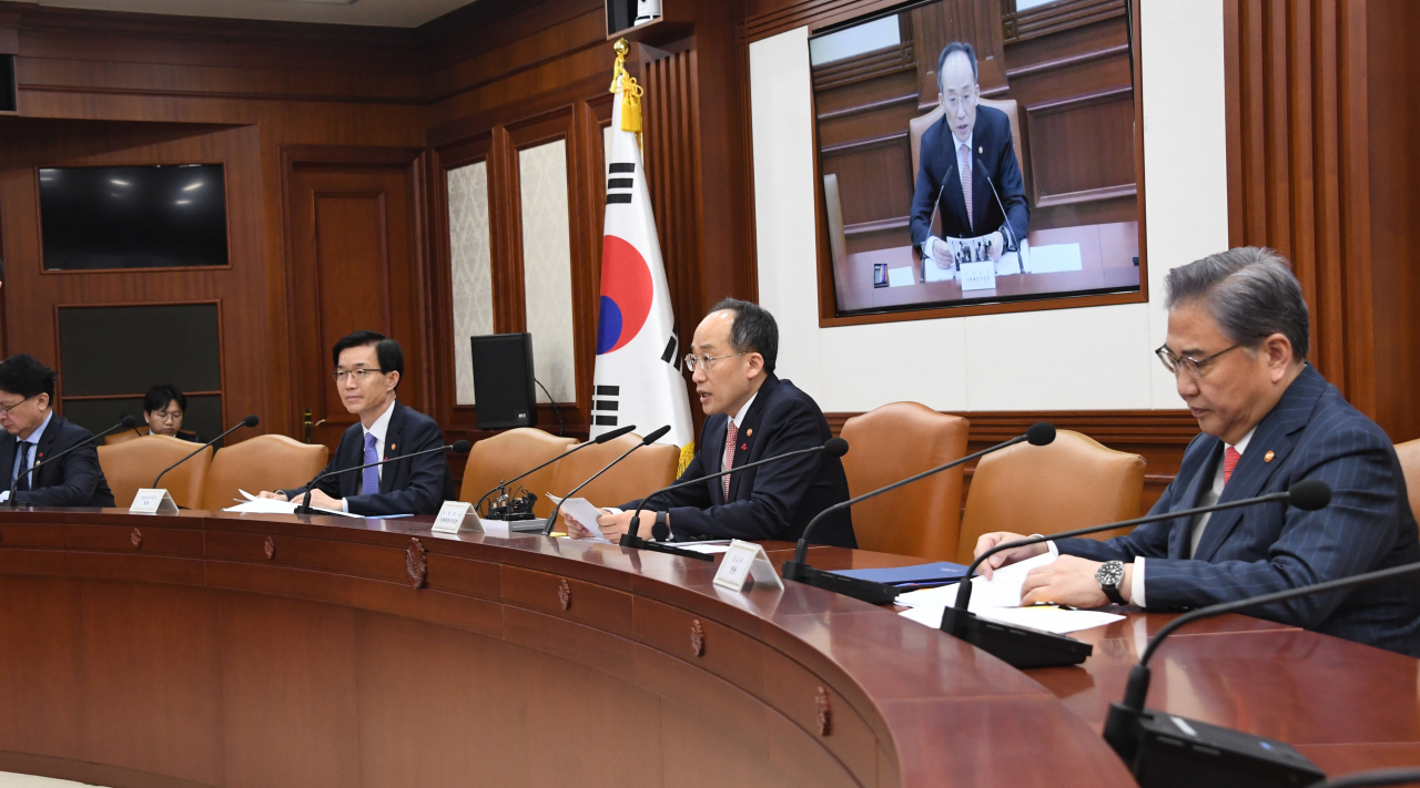 Deputy Prime Minister and Minister of Economy and Finance Choo Kyung-ho (second from right) presides over a meeting of ministers related to economic security and supply chain at the government complex in Seoul on Monday. Foreign Minister Park Jin (right) and Industry Minister Bang Moon-kyu (second from left) also attended. (Yonhap)