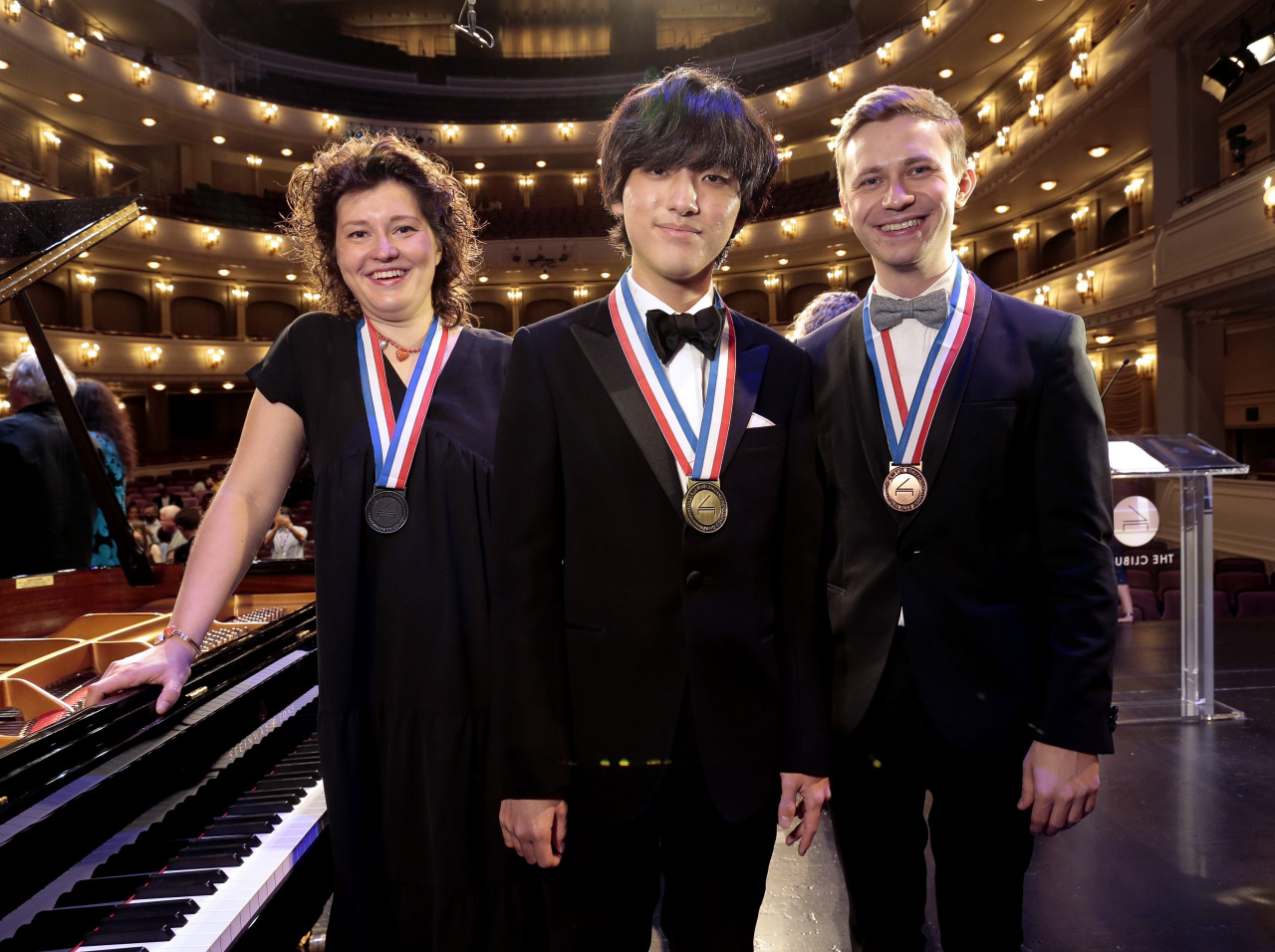 Lim Yun-chan (center), gold medalist at the 17th Van Cliburn International Piano Competition, poses with silver medalist Anna Geniushene (left) from Russia and bronze medalist Dmytro Choni from Ukraine. (Van Cliburn International Piano Competition)