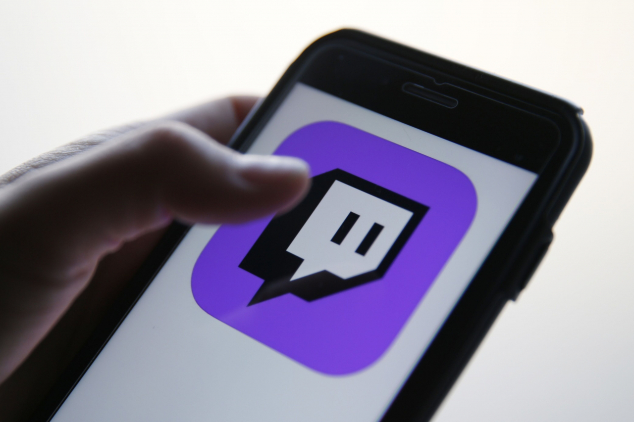 The logo for the Twitch app appears on a smartphone in an illustration. (Bloomberg)