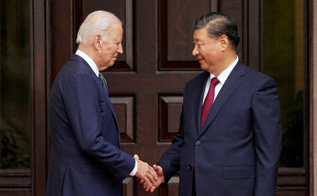 US President Joe Biden shakes hands with Chinese President Xi Jinping at Filoli estate on the sidelines of the Asia-Pacific Economic Cooperation summit, in Woodside, California, Nov.15. (Reuters)