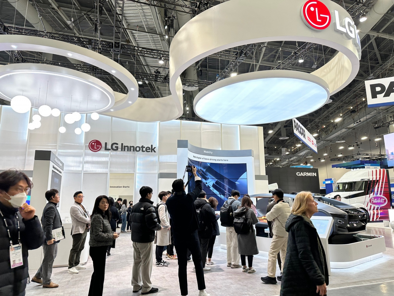 Visitors look around LG Innotek’s exhibition booth at the CES 2024 held at Mandalay Bay Convention Center in Las Vegas on Monday. (LG Innotek)