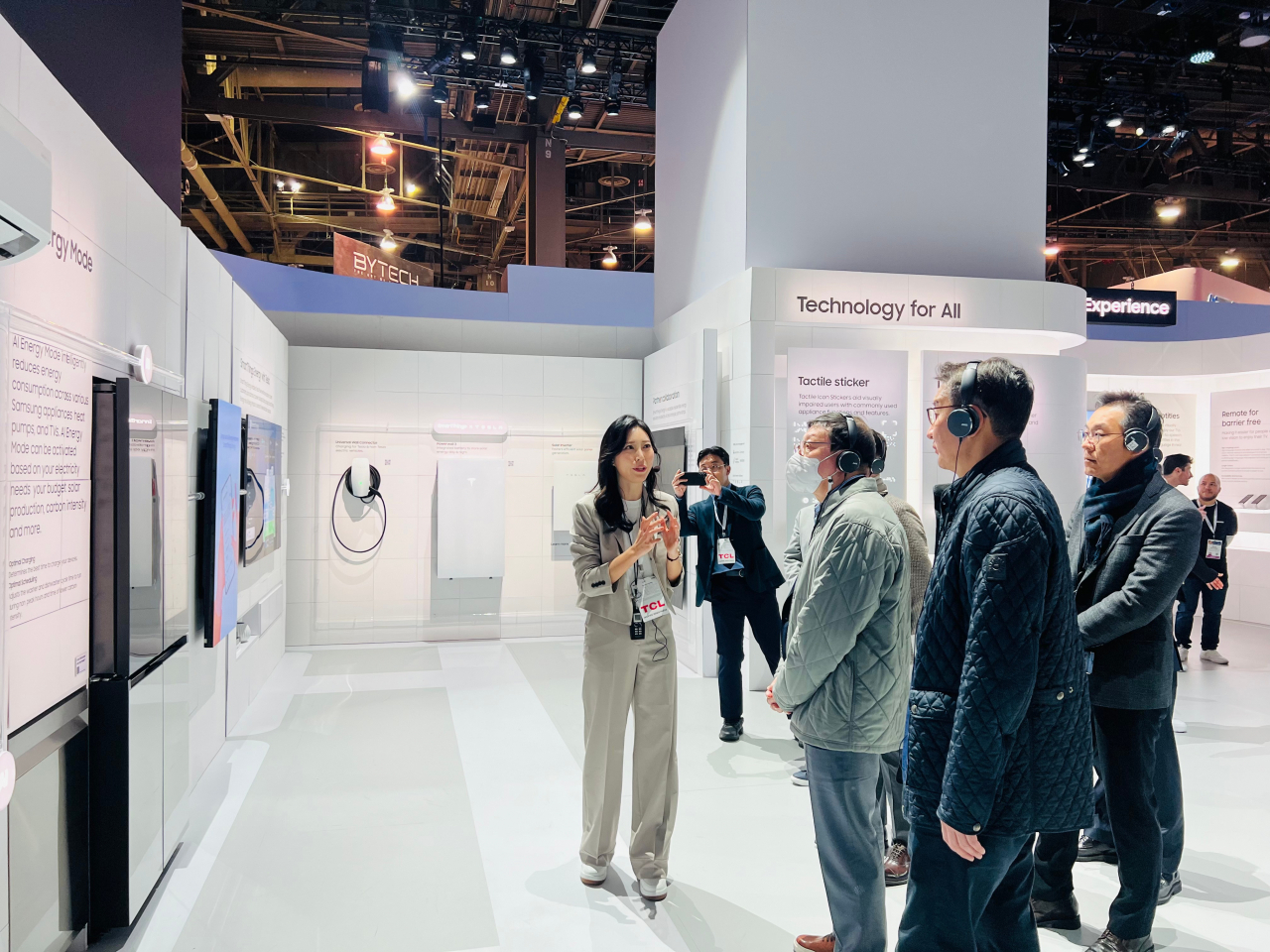 GS Group Chairman Huh Tae-soo soo (third from right) looks around GS Group's exhibition space at the CES 2024 in Las Vegas on Tuesday. (GS Group)