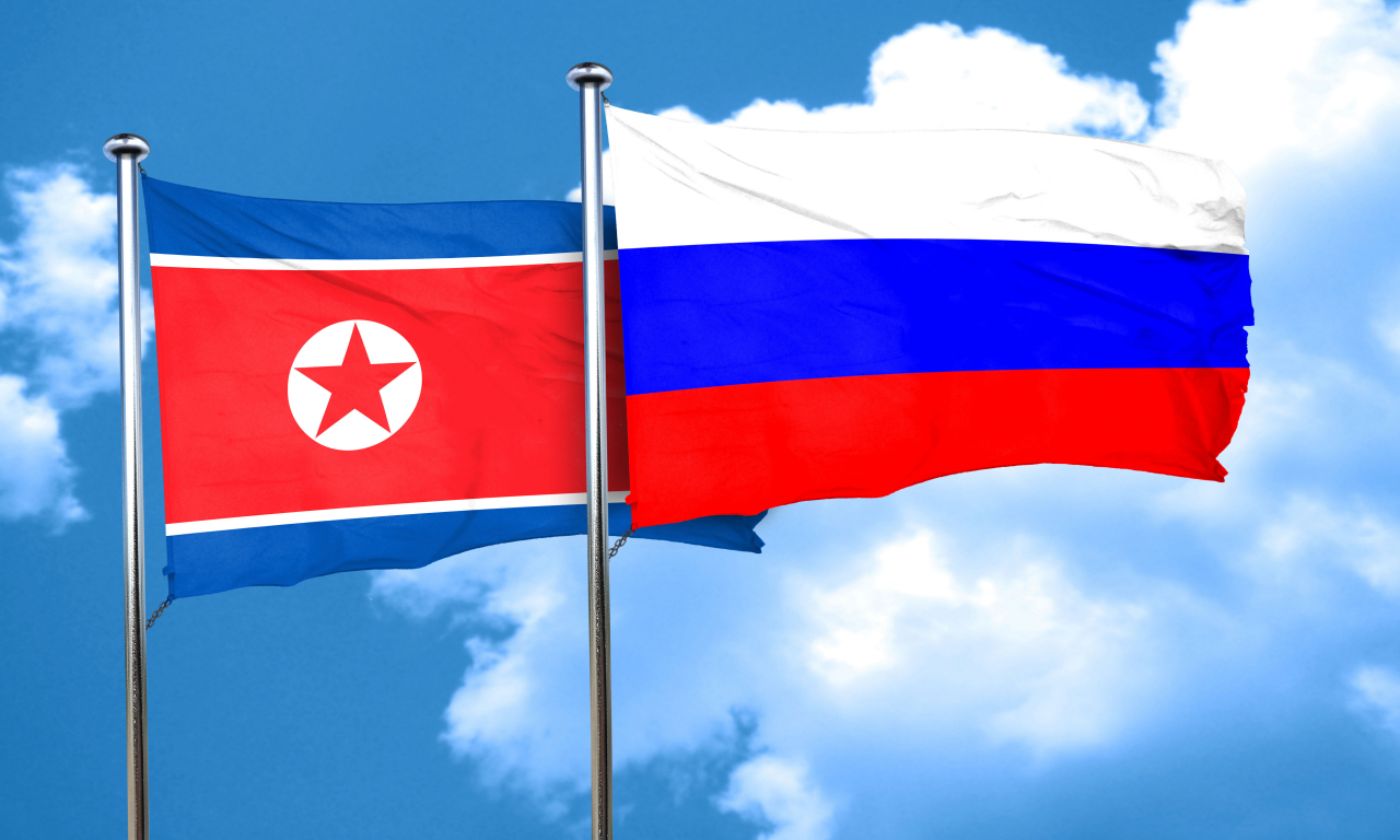 The flags of North Korea (left) and Russia (123rf)