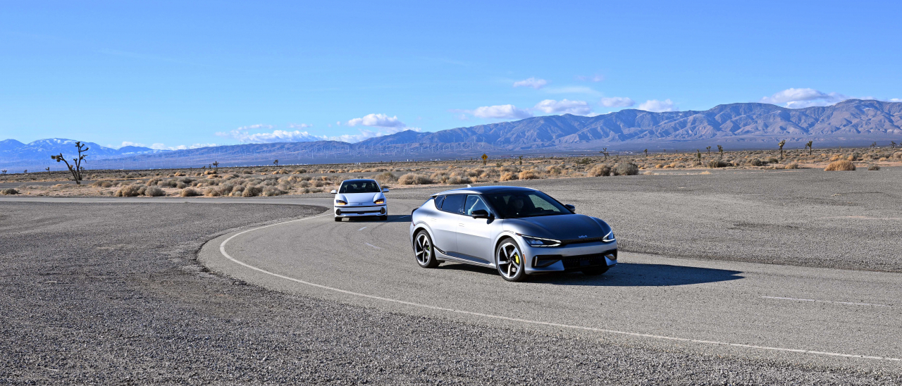 A Kia EV6 GT speeds along the California Proving Ground's extensive track, part of a rigorous 48,000-kilometer durability test to simulate aging in the harsh Mojave Desert. (Hyundai Motor Group)