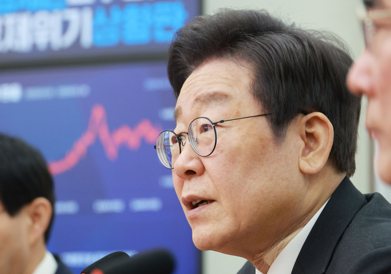 Democratic Party of Korea Chairman Lee Jae-myung explains his party's election pledge to boost the country's birth rate at the National Assembly on Thursday. (Yonhap)