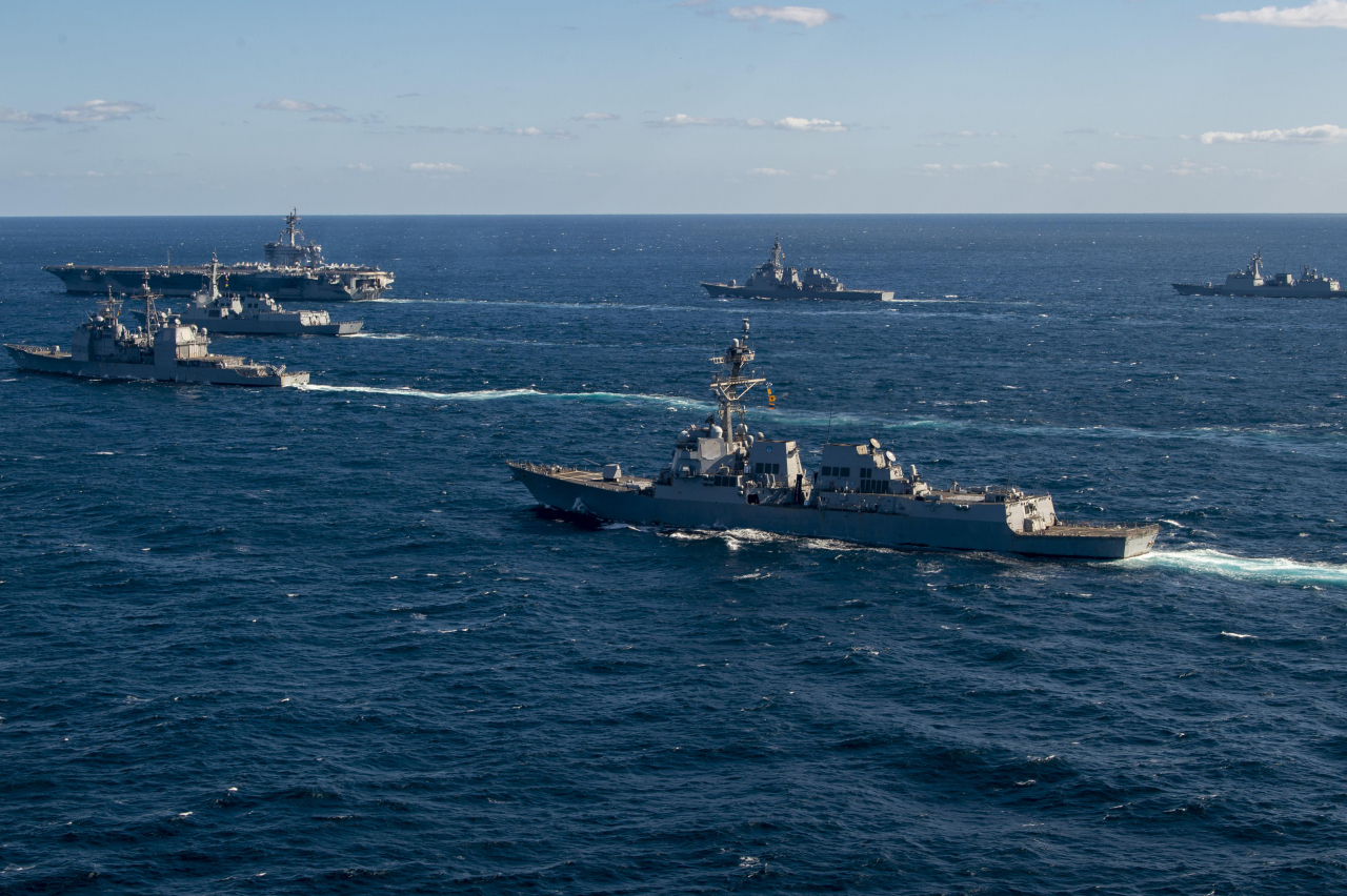(Clockwise from top right) South Korean destroyer Wang Geon, the Japanese Aegis-equipped destroyer Kongo, the nuclear-powered aircraft carrier USS Carl Vinson, South Korea’s Aegis-equipped destroyer Sejong the Great, the USS Princeton and the guided-missile destroyer USS Kidd sail in waters south of the Korean Peninsula, as South Korea, the United States and Japan jointly conduct naval drills following North Korea’s recent launch of a hypersonic missile, in this undated photo released by the Joint Chiefs of Staff on Wednesday. (Yonhap)