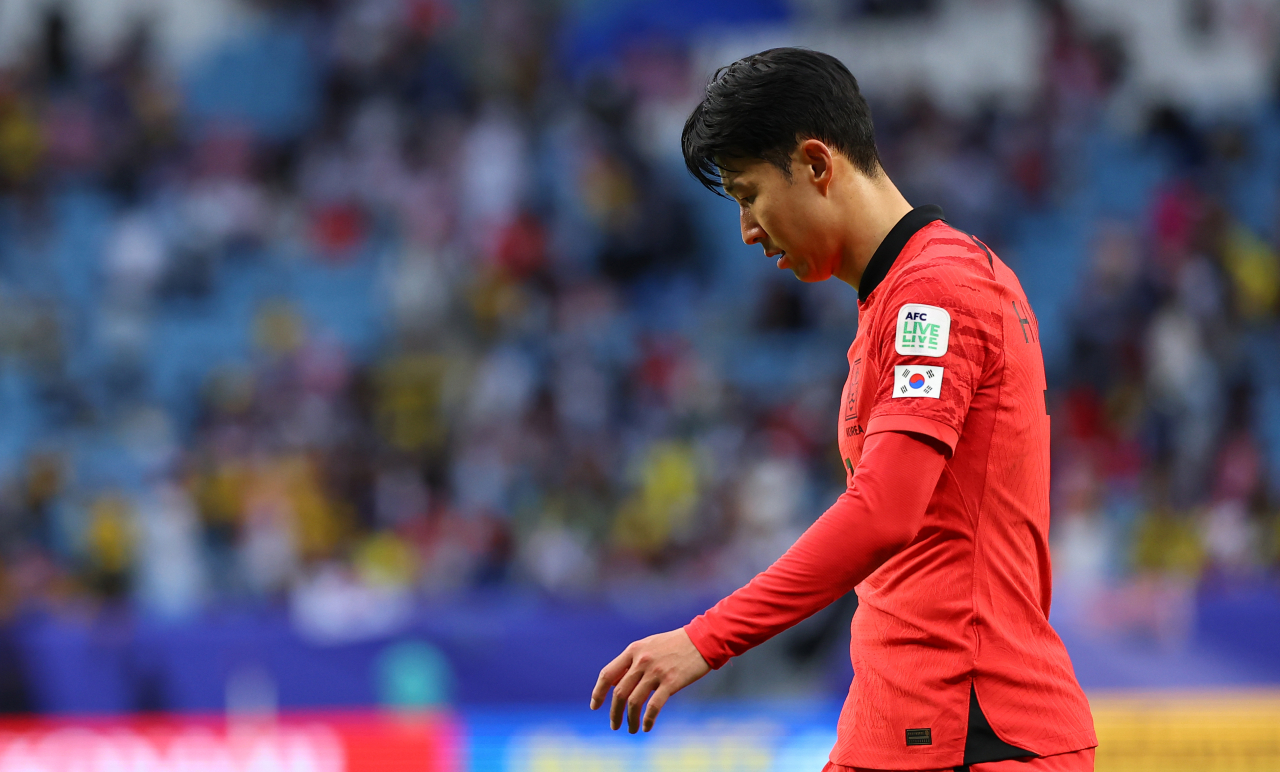 Son Heung-min reacts to a 3-3 draw against Malaysia in the teams' Group match at the Asian Cup at Al Janoub Stadium in Al Wakrah, Qatar, on Tuesday. (Yonhap)