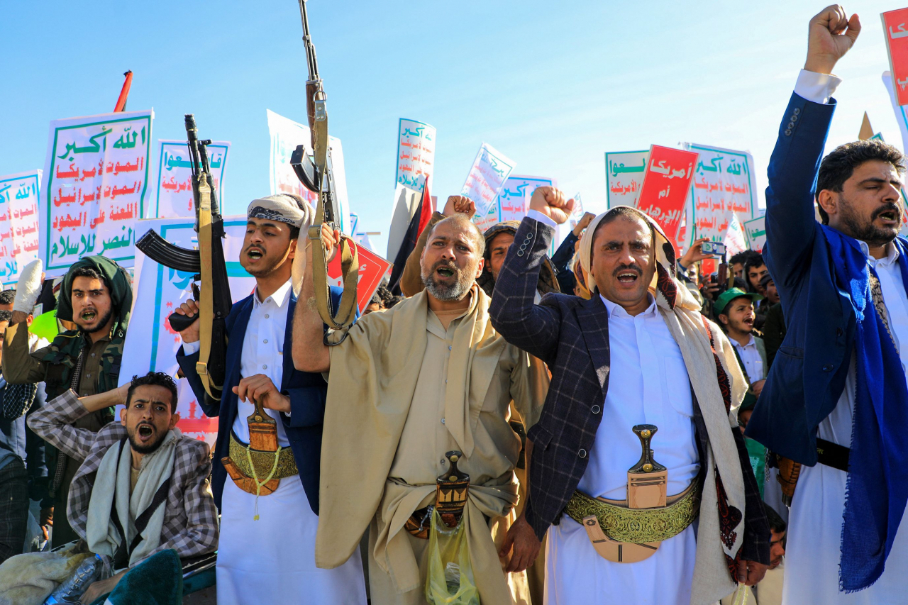 Supporters of Yemen's Houthi movement brandish rifles during an anti-Israel and anti-US rally in the Houthi-controlled capital Sanaa on Friday, amid ongoing battles between Israel and the Palestinian Hamas group in Gaza. (AFP)