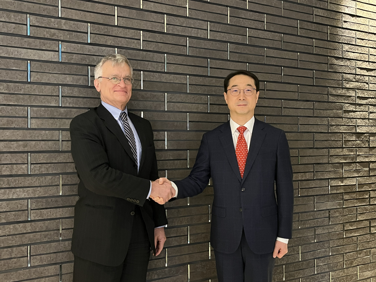 Kim Gunn (right), South Korea's top nuclear envoy, shakes hands with his Swedish counterpart, Peter Semneby, ahead of their talks in Seoul on Feb. 7, 2024. (Ministry of Foreign Affairs, Yonhap)