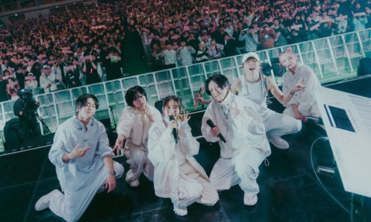 Yoasobi members pose for a photo during the group's concert, at Korea University’s Hwajung Gymnasium in Seoul, Dec. 17. (LIVET, Kato Shumpei)