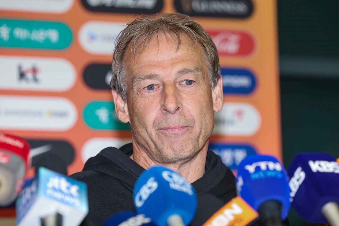 Jurgen Klinsmann, head coach of the South Korean men's national football team, listens to a question from a reporter at Incheon International Airport, west of Seoul, on Thursday. (Yonhap)