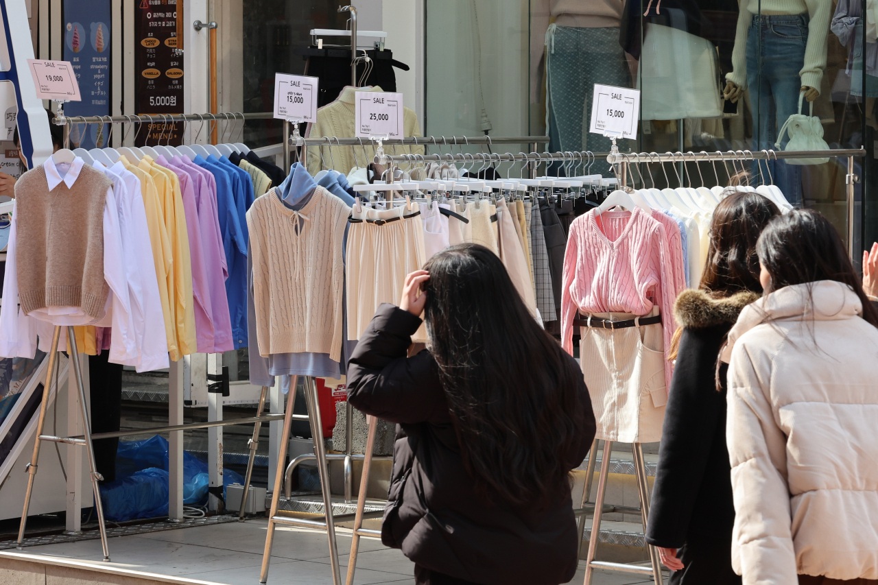 Bright spring clothes are on display at a store front in Seoul's Hongdae district on Tuesday. (Yonhap)