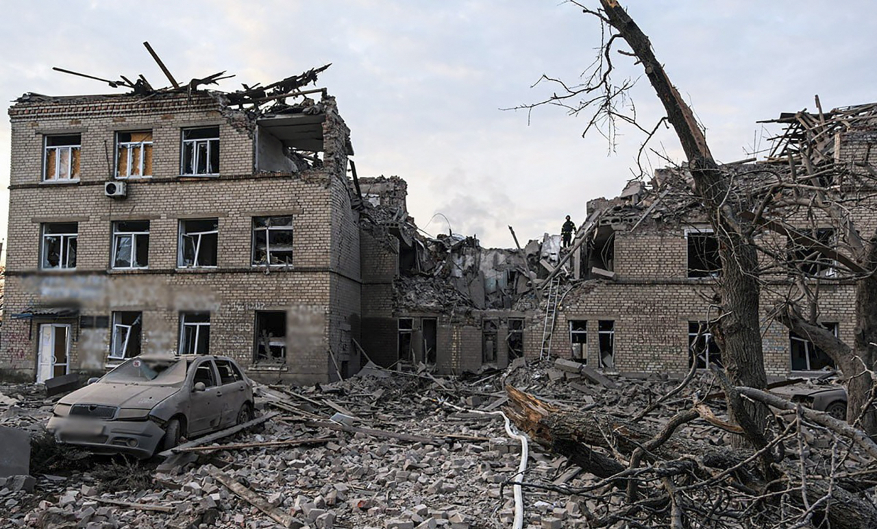 A handout photo made available by the National Police of Ukraine shows the site of the shelling of the civilian hospital building in Selidove city of Donetsk area, Ukraine, on Wednesday amid the Russian invasion. At least three people were killed and another 12 were injured following a Russian strike on a five-floor residential building, and a part of a civilian hospital according to the State Emergency Service. (EPA-Yonhap)