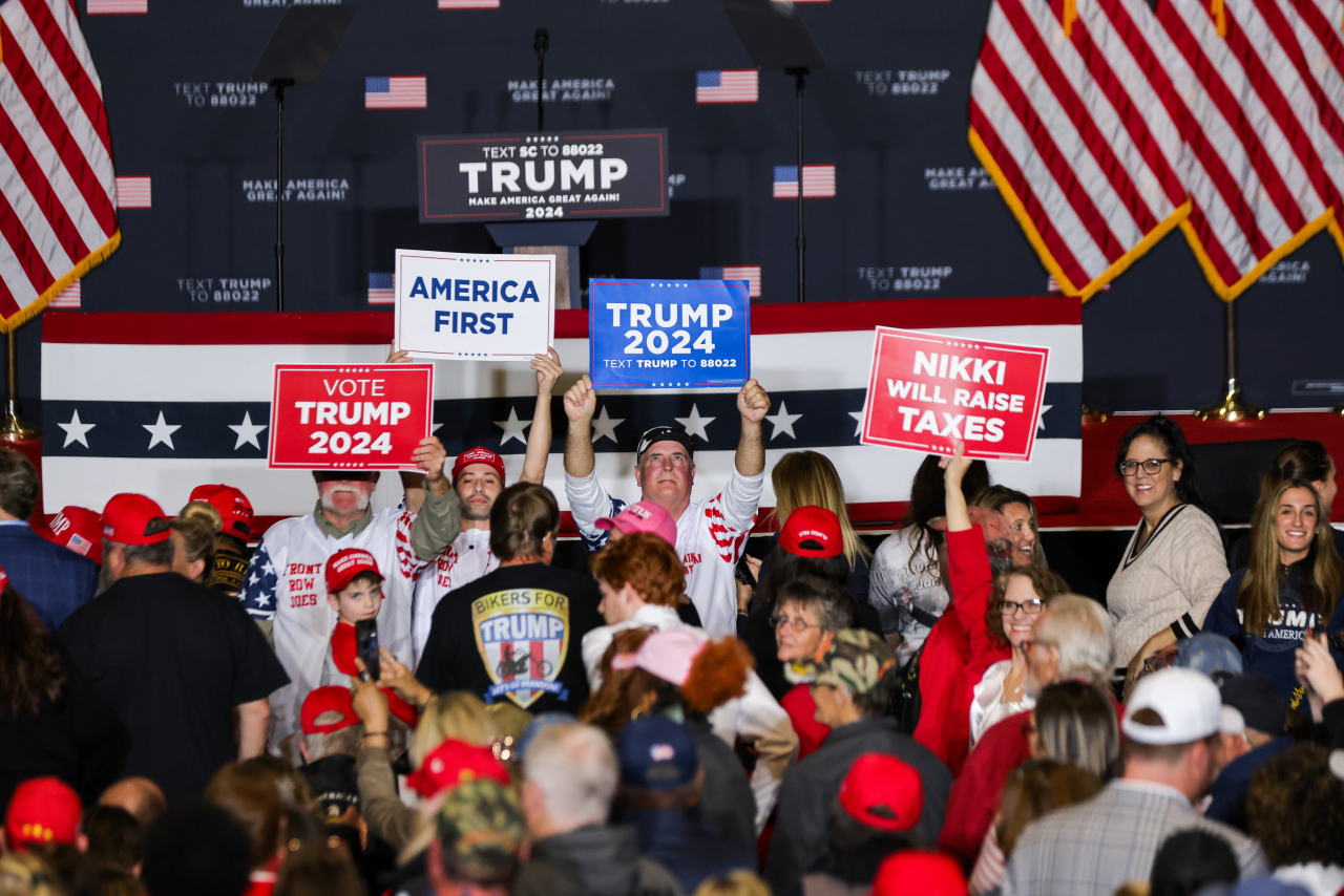 Supporters wait for former US President and Republican presidential candidate Donald Trump to speak at his 'Get Out The Vote Rally' campaign event at the Charleston Area Convention Center in North Charleston, South Carolina, Wednesday. (EPA)