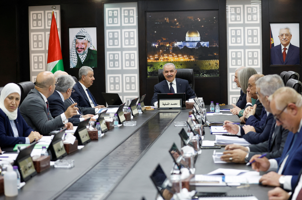 Palestinian Prime Minister Mohammad Shtayyeh convenes a cabinet meeting, amid reports about Prime Minister Shtayyeh announcing his resignation, in Ramallah in the Israeli-occupied West Bank, February 26, 2024. REUTERS/Mohammed Torokman
