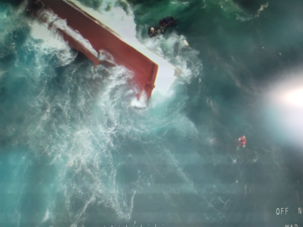 This aerial photo shows a capsized fishing boat on Friday, (Seogwipo Coast Guard Station)