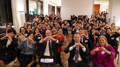 Participants of the 6th ‘Women in Korea (WIR) mentorship program and guests strike the inspire inclusion heart hand pose for International Women's Day at the German Ambassador’s Residence in Seongbuk-gu, Seoul. on March 8, 2024. (KGCCI)