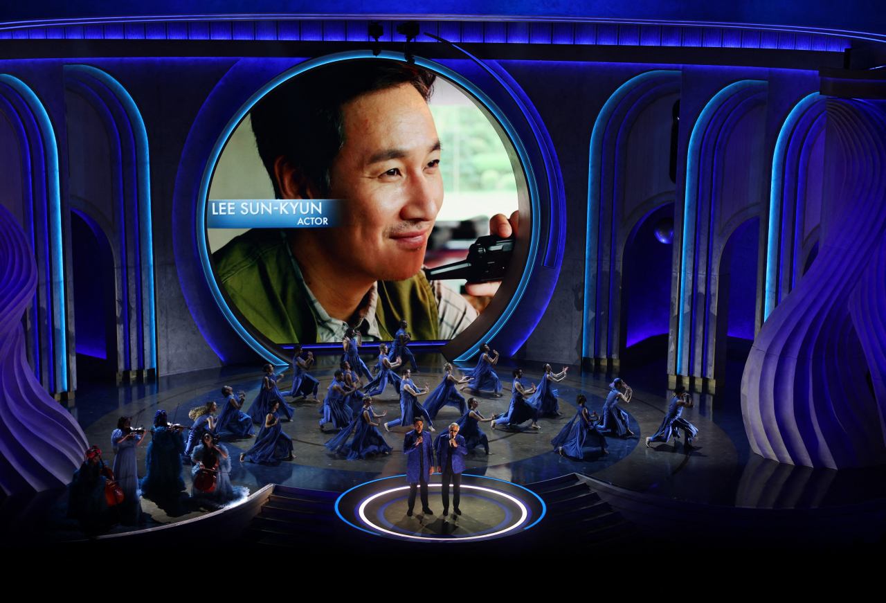 A picture of Lee Sun-kyun is displayed during an in memoriam presentation at the Oscars show at the Academy Awards in Hollywood, Los Angeles, Sunday. (Reuters-Yonhap)