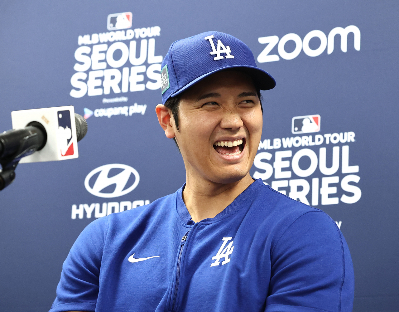 Shohei Ohtani of the Los Angeles Dodgers smiles at a press conference at Gocheok Sky Dome in Seoul on Saturday ahead of a workout for Major League Baseball's Seoul Series. (Yonhap)