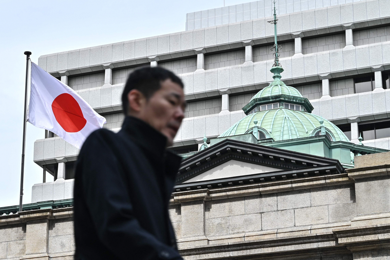 A man walks past the Bank of Japan headquarters complex in central Tokyo on Tuesday. (AFP)