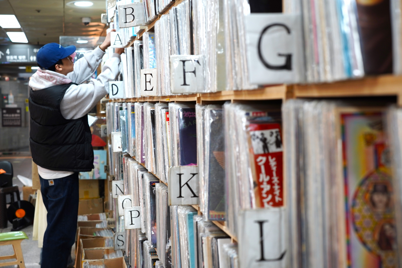 A visitor browses vinyl at Livingsa on Tuesday. (Lee Si-jin/The Korea Herald)