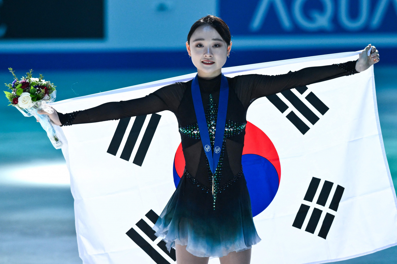 Kim Chae-yeon of South Korea celebrates after winning the bronze medal in the women's singles at the International Skating Union World Figure Skating Championships at Bell Centre in Montreal on Friday. (AFP-Yonhap)