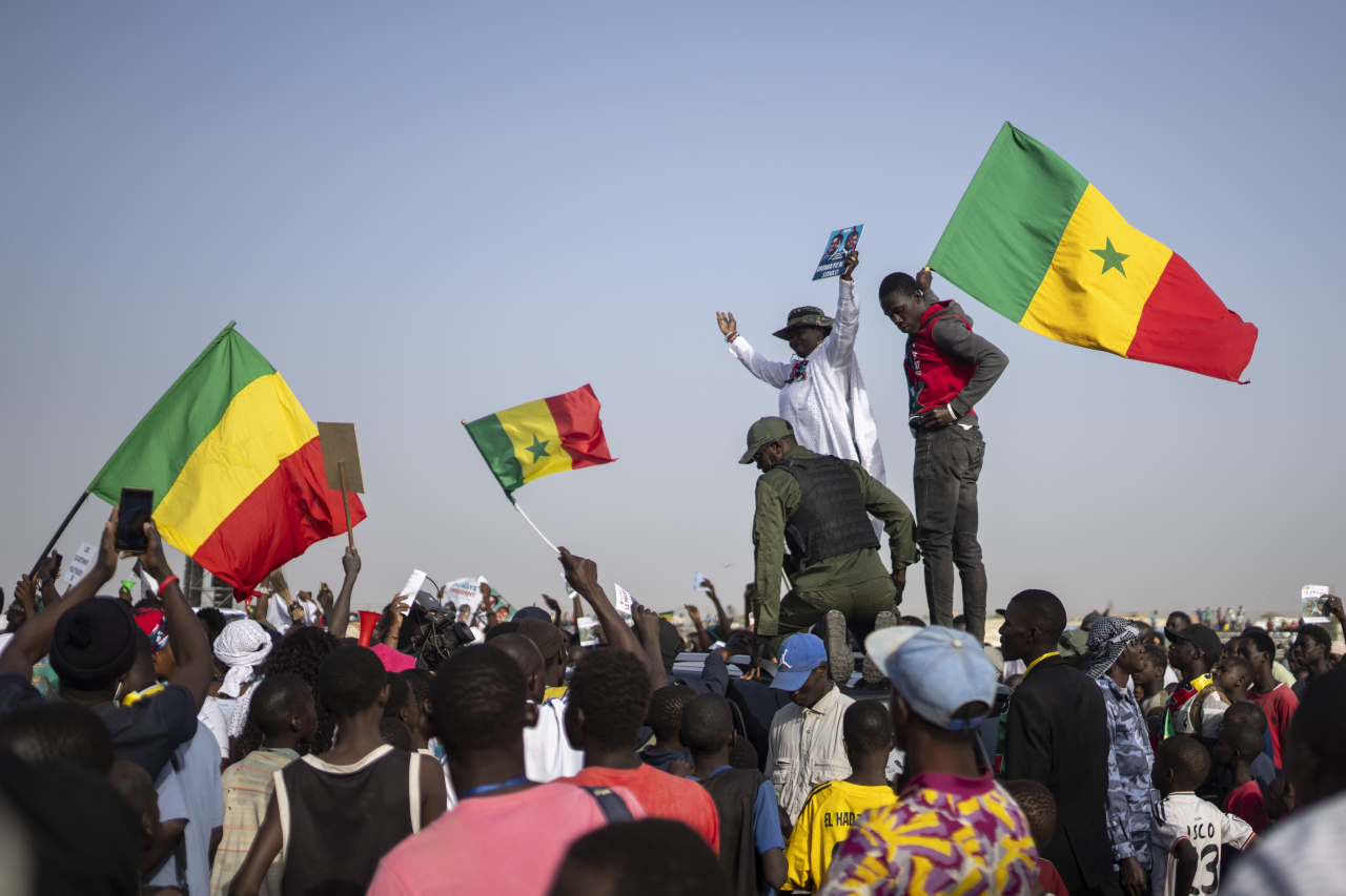 Supporters of presidential candidate Bassirou Diomaye Faye attend a final campaign rally ahead of the presidential elections in Mbour, Senegal, on Friday. (AP)