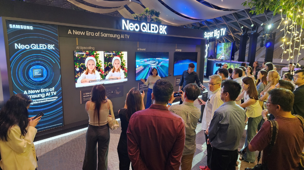Visitors look at Samsung Electronics' 2024 Neo QLED 8K TV in the tech giant's experience zone at Jewel Changi Airport, Singapore. (Samsung Electronics)