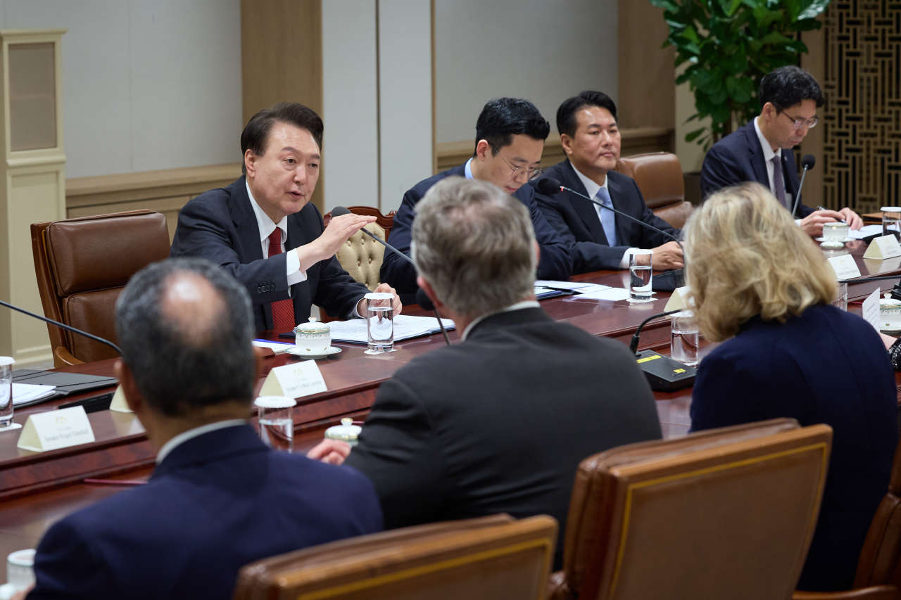 President Yoon Suk Yeol meet with a group of US lawmakers at the presidential office in Seoul on Friday. (Presidential Office)