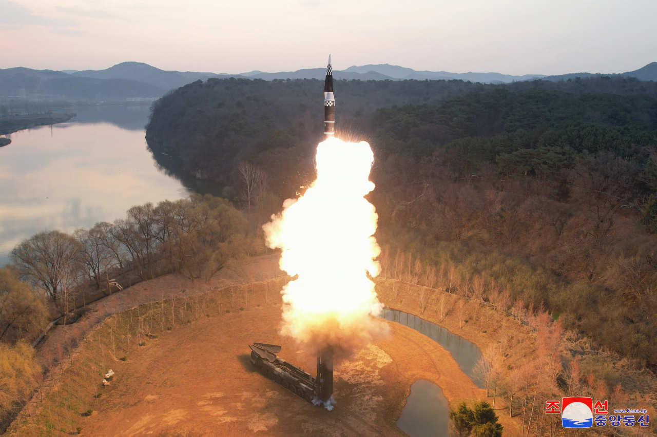 This photo shows the North's launch of a solid-fuel intermediate-range ballistic missile (IRBM), Hwasong-16, carrying a hypersonic warhead on Tuesday. (KCNA)